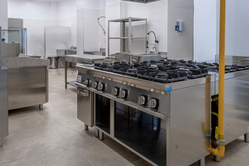 Who provides equipment service during the warranty period and post-warranty maintenance work?